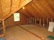 Unfinished attic with window and plywood flooring at 402 Thurman Rd, Stockbridge, GA 30281