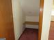 Small closet with a wooden shelf at 402 Thurman Rd, Stockbridge, GA 30281