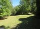 Open backyard, partially wooded, ready for landscaping at 402 Thurman Rd, Stockbridge, GA 30281