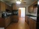 Spacious kitchen with dark wood cabinets and parquet flooring at 402 Thurman Rd, Stockbridge, GA 30281