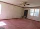 Large bedroom with pink carpet and window at 402 Thurman Rd, Stockbridge, GA 30281
