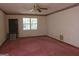 Bright bedroom with ceiling fan and pink carpeting at 402 Thurman Rd, Stockbridge, GA 30281
