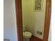 Small half bathroom with toilet and pedestal sink at 402 Thurman Rd, Stockbridge, GA 30281