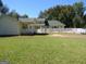 Home exterior showcasing a pool, patio, and fenced yard at 402 Thurman Rd, Stockbridge, GA 30281