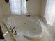 Relaxing jacuzzi tub in a well-lit bathroom at 402 Thurman Rd, Stockbridge, GA 30281
