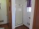 Clean shower stall in a simple bathroom at 402 Thurman Rd, Stockbridge, GA 30281