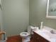Simple bathroom with a toilet, sink, and wood vanity at 402 Thurman Rd, Stockbridge, GA 30281