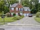 Brick house with two-car garage and driveway at 1716 Shirburn Cir, Riverdale, GA 30296