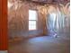 Unfinished basement room with window and plastic covering at 3688 Eagles Beek Cir, Lithonia, GA 30038