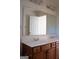 Double vanity bathroom with a large mirror and light fixtures at 3688 Eagles Beek Cir, Lithonia, GA 30038