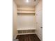 Built-in bench with storage and shelving in basement at 200 Parker Dr, Mcdonough, GA 30253