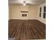 Spacious living room with hardwood floors and a fireplace at 200 Parker Dr, Mcdonough, GA 30253