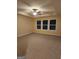 Large main bedroom with plush carpeting and ample natural light at 200 Parker Dr, Mcdonough, GA 30253