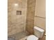 Bathroom with beige tile shower, toilet, and granite vanity at 200 Parker Dr, Mcdonough, GA 30253