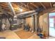Unfinished basement with HVAC unit and ample storage space at 5260 Island Dr, Stone Mountain, GA 30087