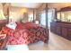 Spacious bedroom with a large four-poster bed and ample natural light at 5260 Island Dr, Stone Mountain, GA 30087