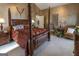 Primary bedroom with a four-poster bed and sitting area at 5260 Island Dr, Stone Mountain, GA 30087