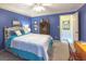 Serene bedroom with a queen-size bed and a blue color scheme at 5260 Island Dr, Stone Mountain, GA 30087
