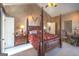 Main bedroom with a post bed and high ceilings at 5260 Island Dr, Stone Mountain, GA 30087