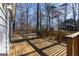 Wooden deck overlooking a wooded backyard with seating at 5260 Island Dr, Stone Mountain, GA 30087