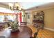 Bright dining room with a charming chandelier and hardwood floors at 5260 Island Dr, Stone Mountain, GA 30087