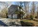 Two-car garage and deck on gray sided house at 5260 Island Dr, Stone Mountain, GA 30087