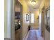 Bright hallway with carpeted floor and neutral wall colors at 5260 Island Dr, Stone Mountain, GA 30087