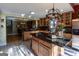 Large kitchen with island, ample cabinet space, and chandelier at 5260 Island Dr, Stone Mountain, GA 30087