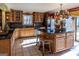 Large kitchen with an island, ample cabinet space, and granite countertops at 5260 Island Dr, Stone Mountain, GA 30087