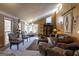 Living room with leather couches and large window at 5260 Island Dr, Stone Mountain, GA 30087