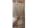 A tiled shower with a built-in seat and glass enclosure at 5260 Island Dr, Stone Mountain, GA 30087