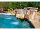 Swimming pool with stone water features at 197 Westbrook Rd, Carrollton, GA 30116