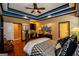 Bright bedroom with hardwood floors, ceiling fan, and built-in desk at 197 Westbrook Rd, Carrollton, GA 30116
