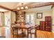 Charming dining room with hardwood floors and a beautiful hutch at 230 Haynes Rd, Moreland, GA 30259