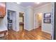 Hardwood floor hallway with access to laundry, bedroom, and office at 230 Haynes Rd, Moreland, GA 30259