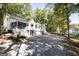 Two story house with porch, screened porch and attached garage at 230 Haynes Rd, Moreland, GA 30259