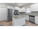 Modern kitchen with stainless steel appliances and granite countertops at 8069 Louis Dr, Locust Grove, GA 30248