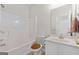 Clean bathroom with a tub, toilet, vanity, and a large mirror at 920 Eskew Rd, Mcdonough, GA 30252
