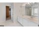 Bathroom with double vanity, large mirror, and separate shower and tub at 920 Eskew Rd, Mcdonough, GA 30252