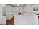 Spacious kitchen with white cabinets, hardwood floors, and modern appliances at 920 Eskew Rd, Mcdonough, GA 30252