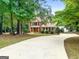 Two-story home with driveway and landscaping at 920 Eskew Rd, Mcdonough, GA 30252
