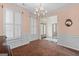 Bright dining room with hardwood floors and plantation shutters at 920 Eskew Rd, Mcdonough, GA 30252