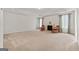 Primary bedroom with fireplace, carpet, and two armchairs at 920 Eskew Rd, Mcdonough, GA 30252