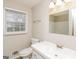 Clean bathroom with white vanity, toilet and shower at 155 Castleair Ct. Ne, Kennesaw, GA 30144