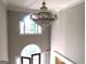 High ceiling foyer with crystal chandelier at 5335 Saville Dr, Acworth, GA 30101