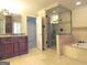 Elegant bathroom with a large glass shower, soaking tub, and double vanity at 5335 Saville Dr, Acworth, GA 30101
