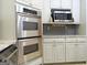 Stainless steel double oven and microwave in kitchen at 5335 Saville Dr, Acworth, GA 30101