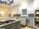 Spacious kitchen featuring granite countertops, stainless steel appliances, and an island at 5335 Saville Dr, Acworth, GA 30101