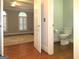 Small bathroom with toilet and hardwood floors at 5335 Saville Dr, Acworth, GA 30101