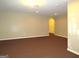 Finished basement room with neutral walls and carpeting at 5335 Saville Dr, Acworth, GA 30101